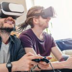 Gaming concept. Cheerful people having fun with new trends technology